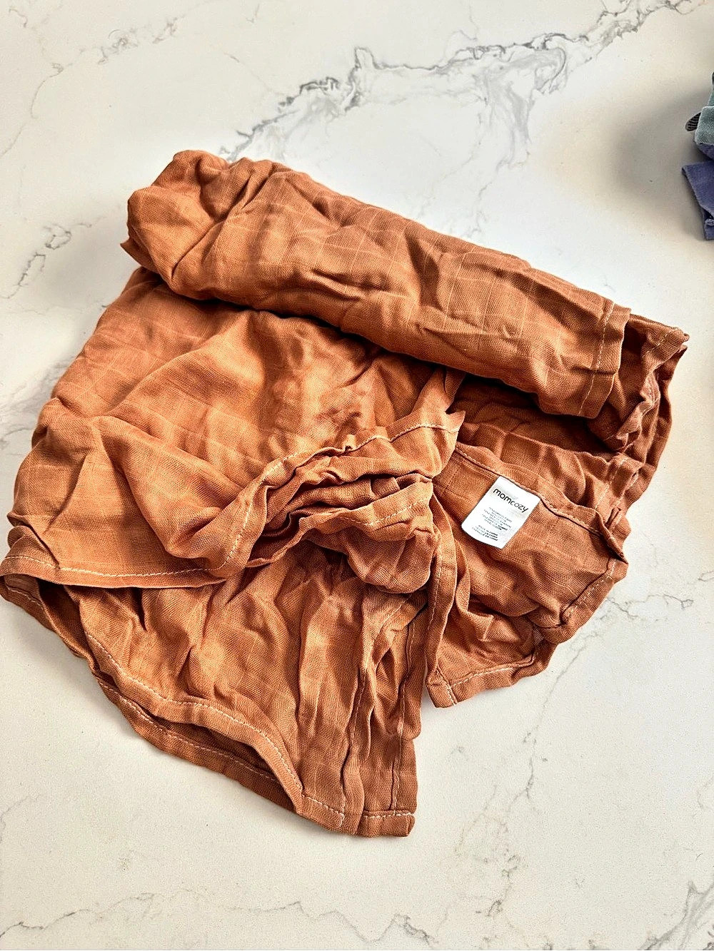 momcozy Brown muslin baby swaddle blanket